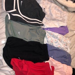9 pairs of size small Nike shorts